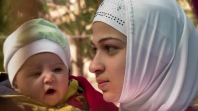 A woman and child at the Yayladagi refugee camp