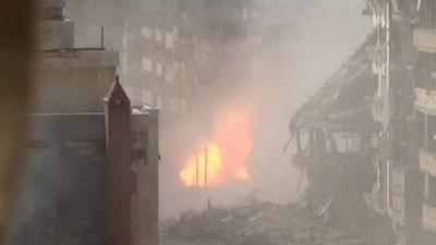 Unverified footage from Homs of shell making impact