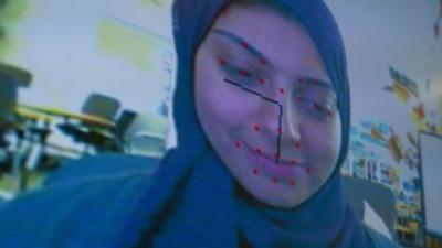 Woman with facial recognition software