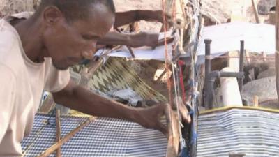 A man weaves traditional clothes in Somalia