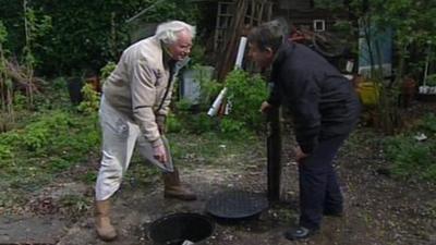 Trevor Morris and BBC South reporter Joe Campbell looking at Mr Morris's borehole