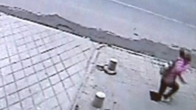 Girl falling through pavement