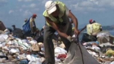 Rubbish scavengers working at landfill