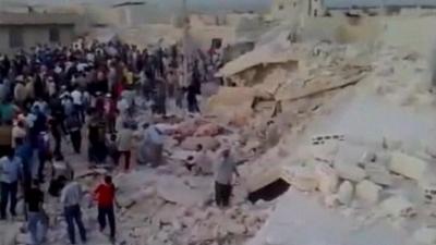 Crowds helped rescue people in the rubble following a huge explosion in Hama