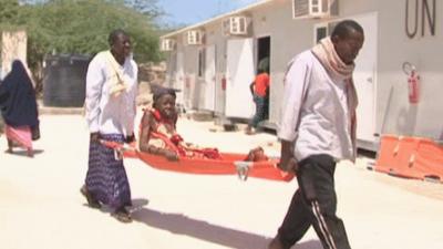 A Somali patient being carried to the AU hospital