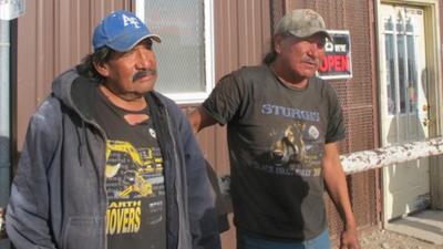 Two men drinking on the streets of White Clay, Nebraska 23 April 2012