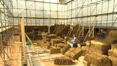 Houses of straw under construction