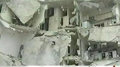 Building damaged by blasts in Syrian city of Idlib