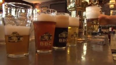 Pints of Bogata Beer Company beer lined up on a bar