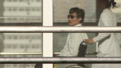 Chinese dissident Chen Guangcheng in a wheelchair