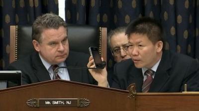 Chen Guangcheng speaks by phone to a Congressional hearing