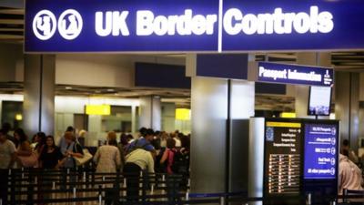 Border control in Terminal 5 of London's Heathrow airport