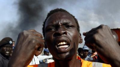 A man stands next to a market in Rubkona which was targeted in an air strike by the Sudanese air force