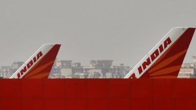 Air India planes park at Indira Gandhi International Airport in New Delhi, India