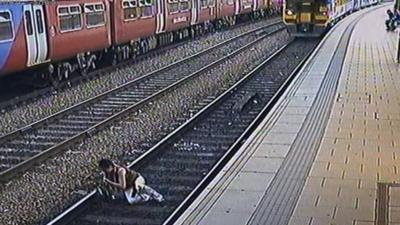 A woman stumbles in front of a train in Leeds station