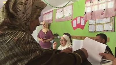 Woman voting in Algerian elections