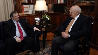 Greek Socialist leader Evangelos Venizelos, left, meets with Greek President Karolos Papoulias in Athens