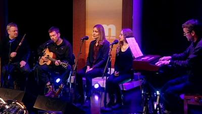 Damon Albarn with musicians