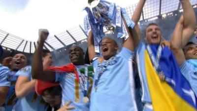 Manchester City lift the Premier League trophy