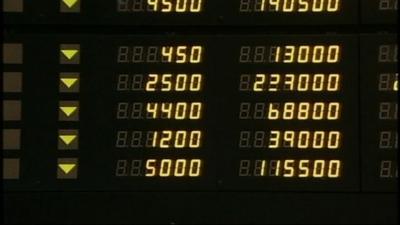 A markets board at the Hong Kong Stock Exchange