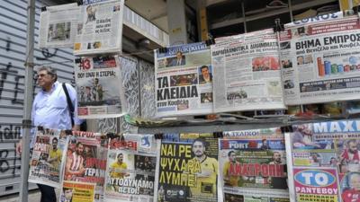 Newspapers at a kiosk in Athens, Greece