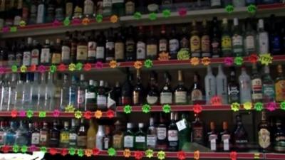 Bottles of alcohol on shop shelves