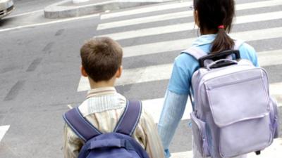 Children carrying school bags