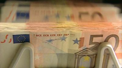 Euros being counted in a note-counting machine