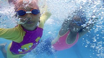 Children swimming under water