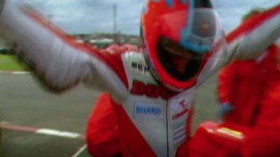 Carl Fogarty celebrates winning the NW200