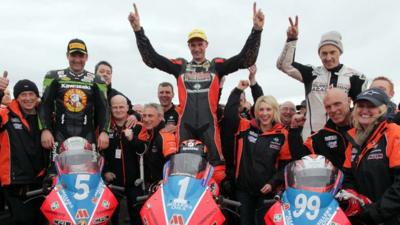 KMR Kawasaki team celebrate a clean sweep of the podium places in Thursday's Supertwins event at the North West 200