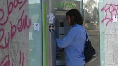 Woman at Spanish cash machine