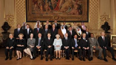 Queen Elizabeth poses for a photograph with sovereign monarchs