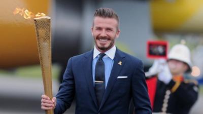 David Beckham carries Olympic torch