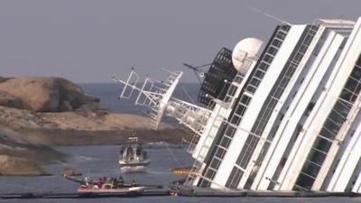 Small boats around the Costa Concordia off the island of Giglio