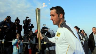 Ben Ainslie leaves from Lands End with Olympic torch