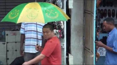 A Chinese man in one of Tanzania's markets