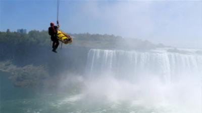 Rescue team air lifting the man on a stretcher