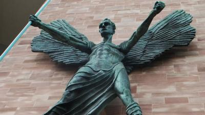 Statue on wall of Coventry Cathedral