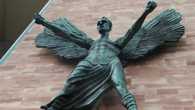 Statue on wall of Coventry Cathedral