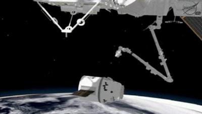 Computer image of how SpaceX capsule is expected to dock with ISS