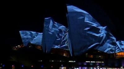 Light show projected onto Sydney Opera House