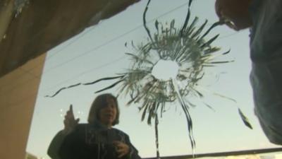 Bullet hole through glass