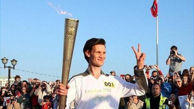 Matt Smith carrying the Olympic torch