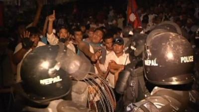 Protesters clash with riot police in Kathmandu
