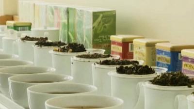 Tea cups, tea leaves and tea caddies