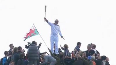 The torch was carried to the top of Snowdon by Sir Chris Bonington