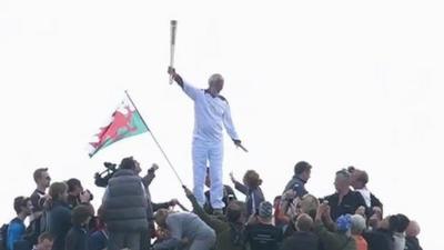 The torch was carried to the top of Snowdon by Sir Chris Bonington