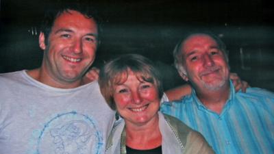 Adam Pickles with his parents