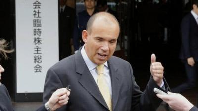 Former Olympus Corp. President and CEO Michael Woodford speaks to reporters